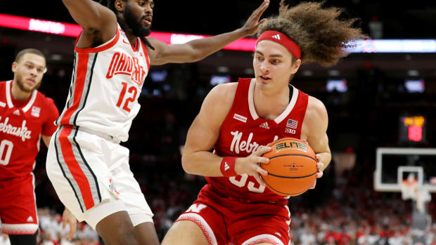 Feb 29, 2024; Columbus, Ohio, USA; Nebraska Cornhuskers forward Josiah Allick (53) moves the ball as Ohio State Buckeyes guard Evan Mahaffey (12) defends during the first half at Value City Arena.
